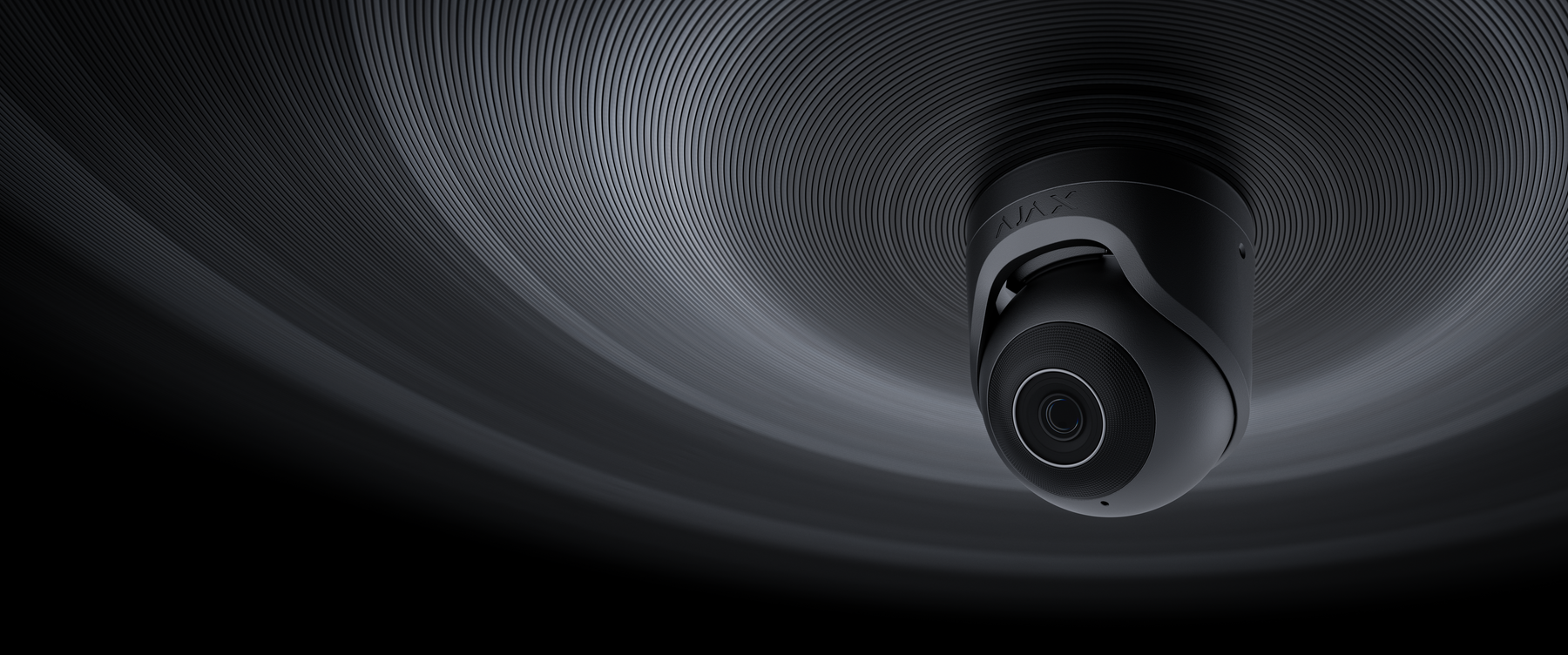 Black Ajax TurretCam mounted against a sculpted ceiling